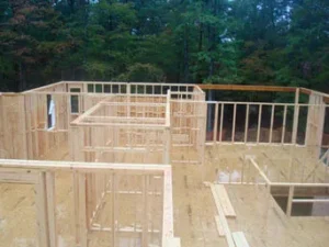 Interior view of new residential construction showing rough wooden wall framing
